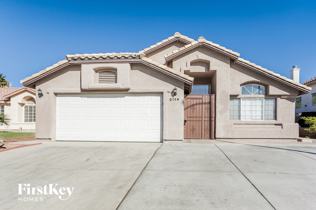 A house with a garage door that says FirstKey Homes.