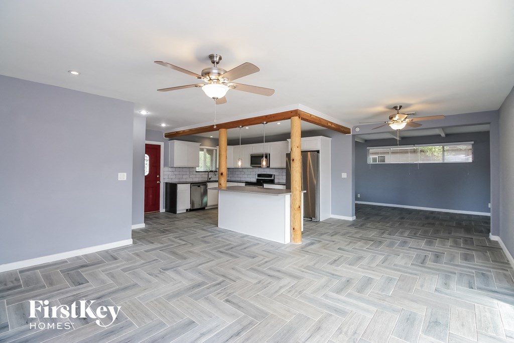 the living room and kitchen are open to the dining room