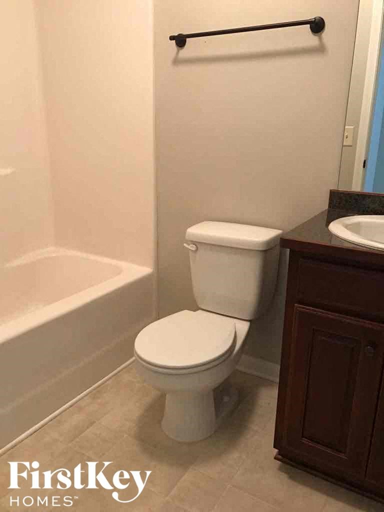 a bathroom with a toilet and a sink