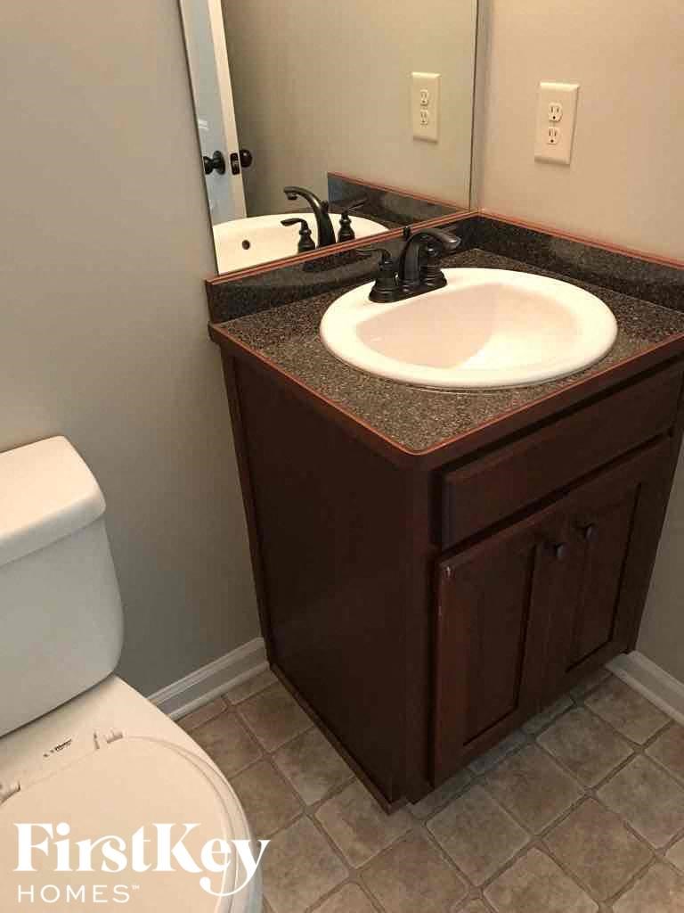 a bathroom with a sink and a toilet