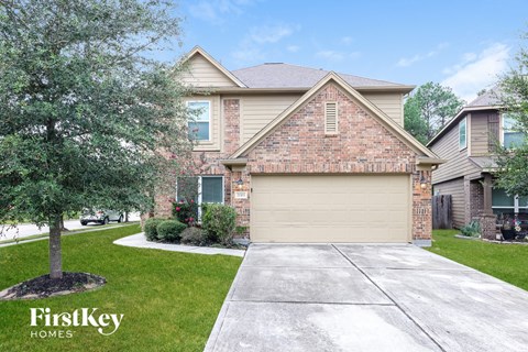 a house with a driveway and a garage door