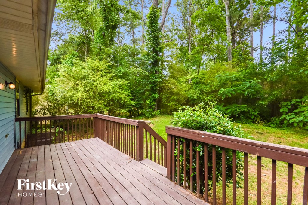 a deck with a view of the woods