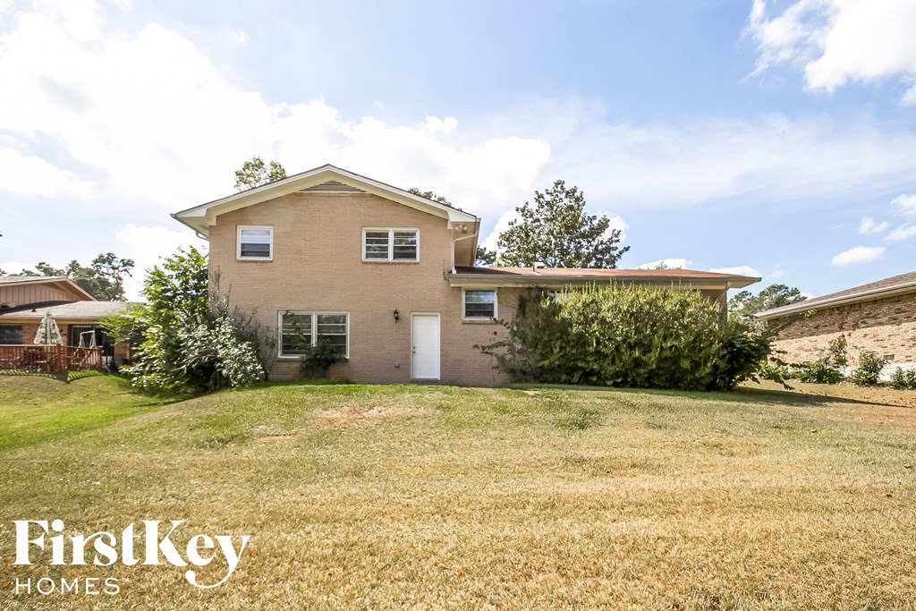 a house with a yard and a white door