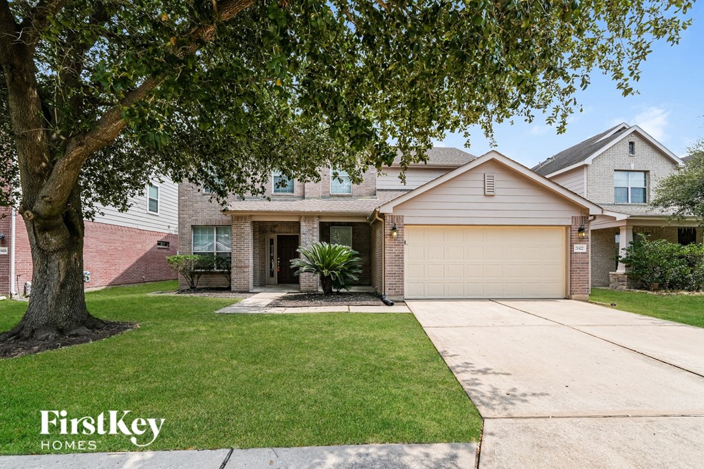 A house with a tree in front of it.