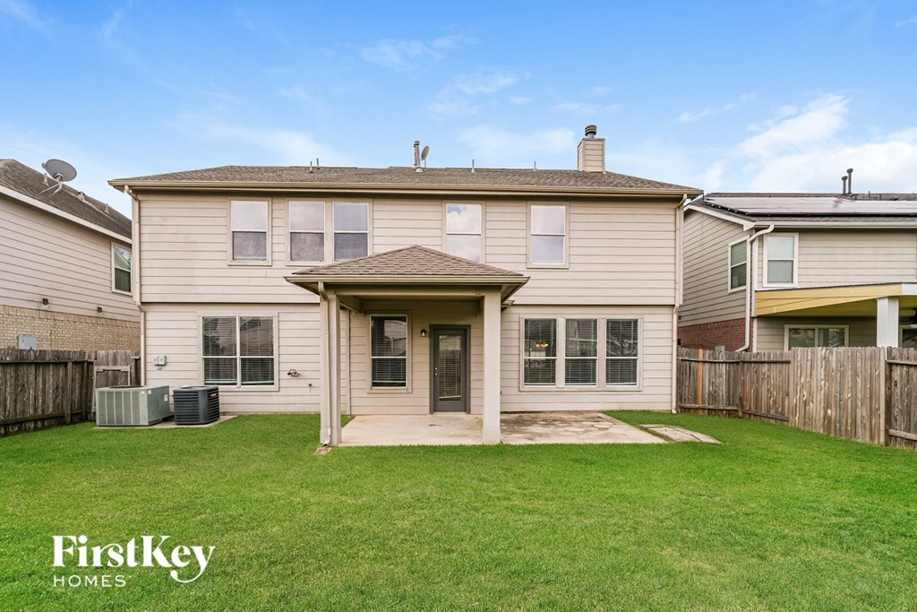 A house with a lawn in front of it.