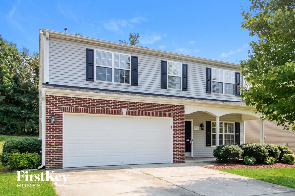 a brick house with a white garage door
