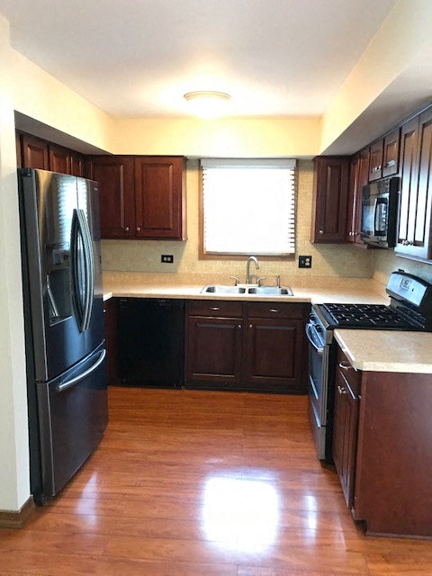 a kitchen with a stove and a refrigerator