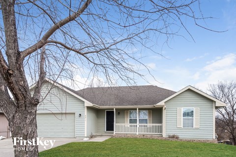 a house with a tree in front of it