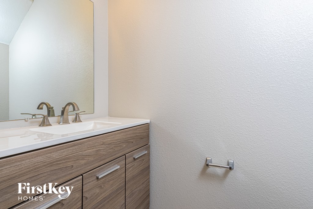 a bathroom with a sink and a mirror