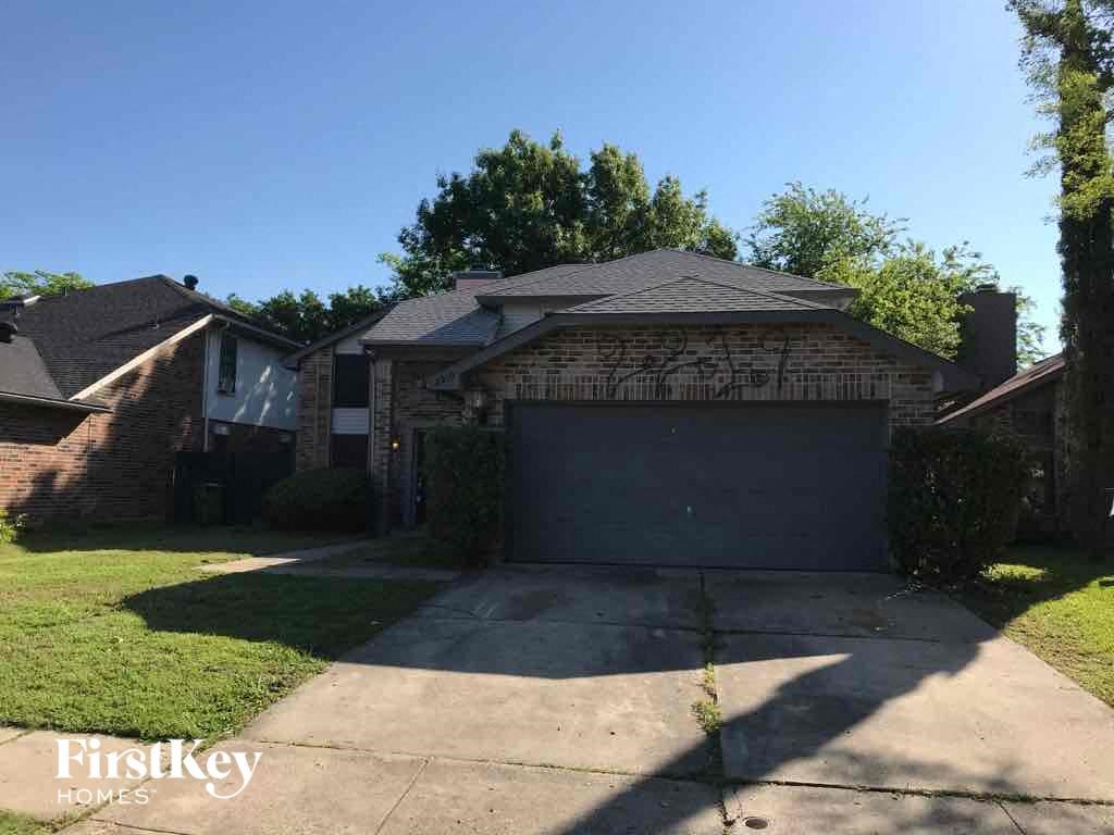 a house with a driveway and a garage door