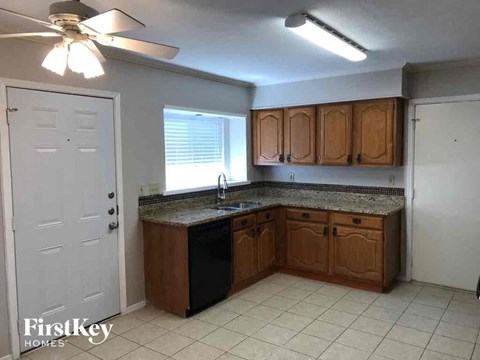 a kitchen with wooden cabinets and a counter top