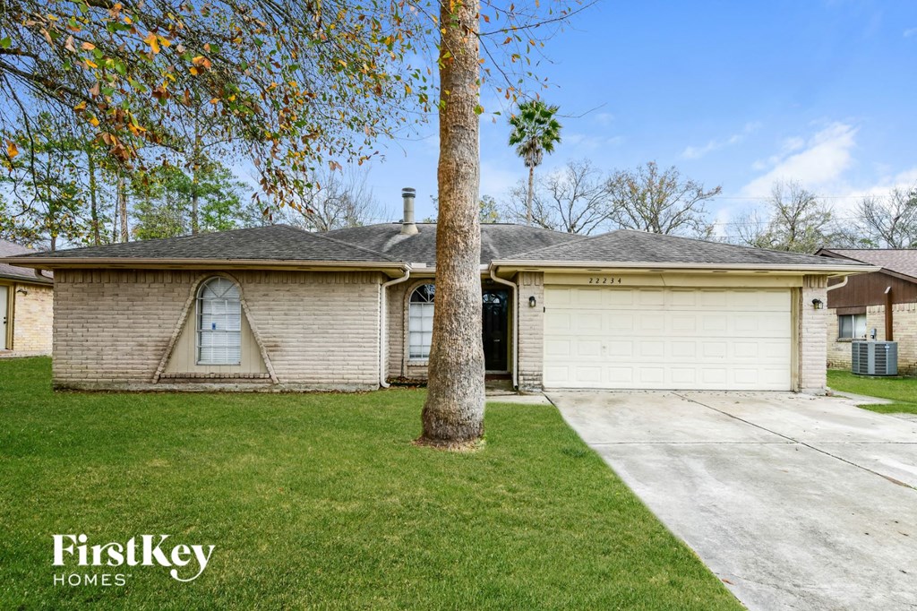 A house with a tree in front of it.