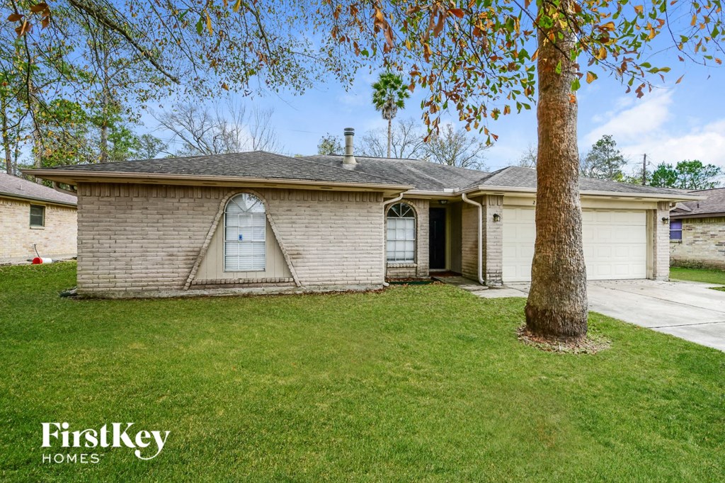 A house with a tree in front of it.