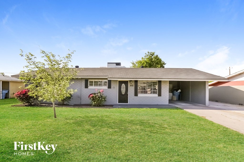 a house with a lawn in front of it