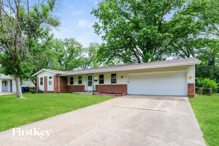 A house with a garage is for sale.