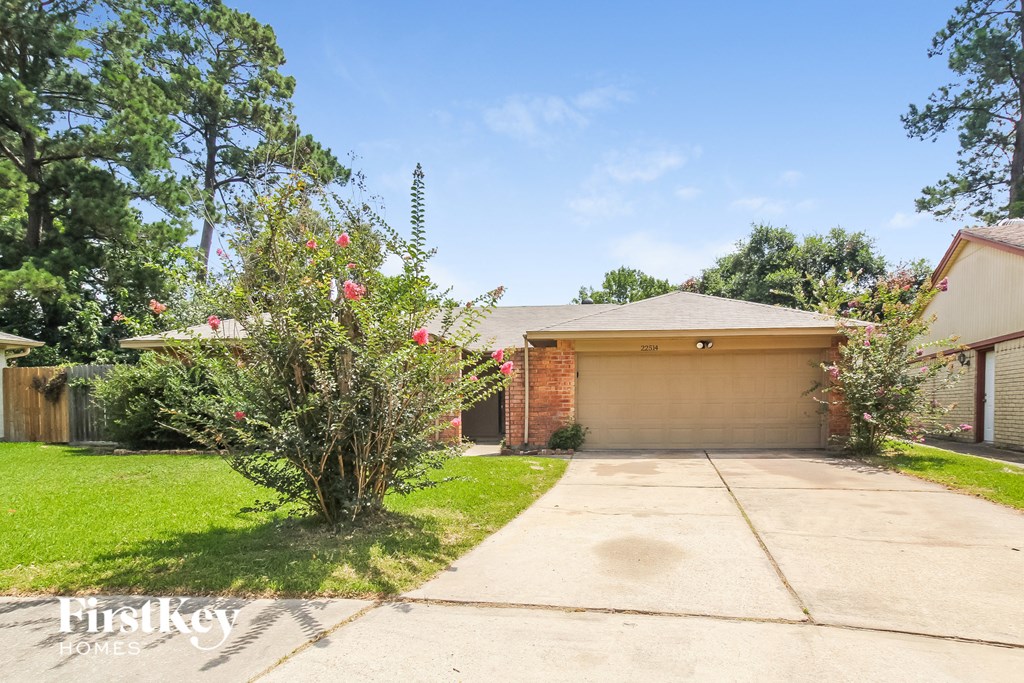 a house with a driveway and a garage door