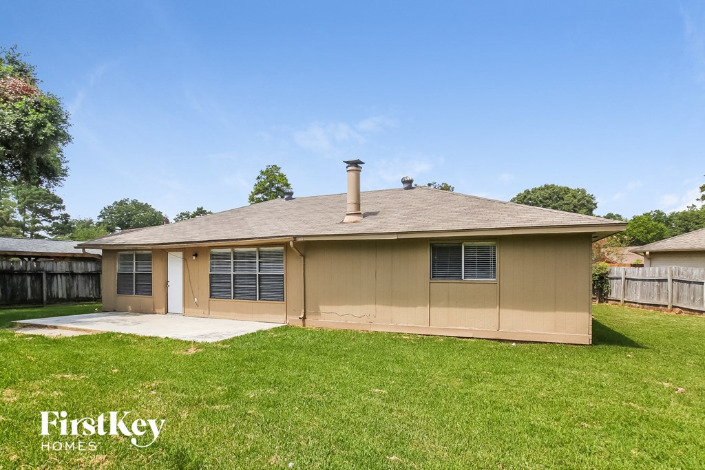 the front of a house with a yard and a garage