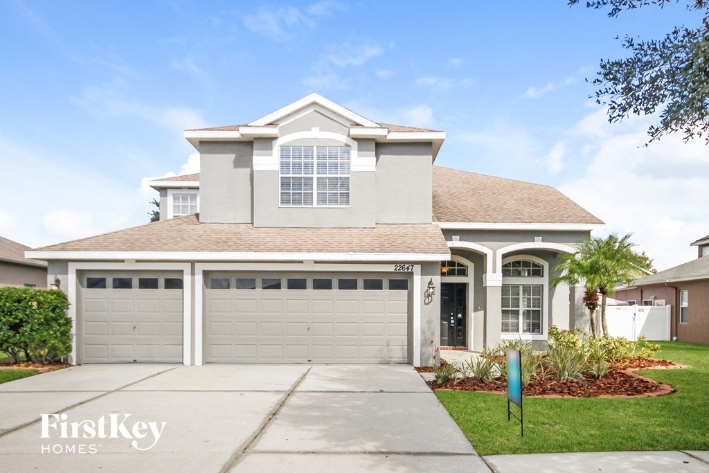 A large house with a garage is for sale.