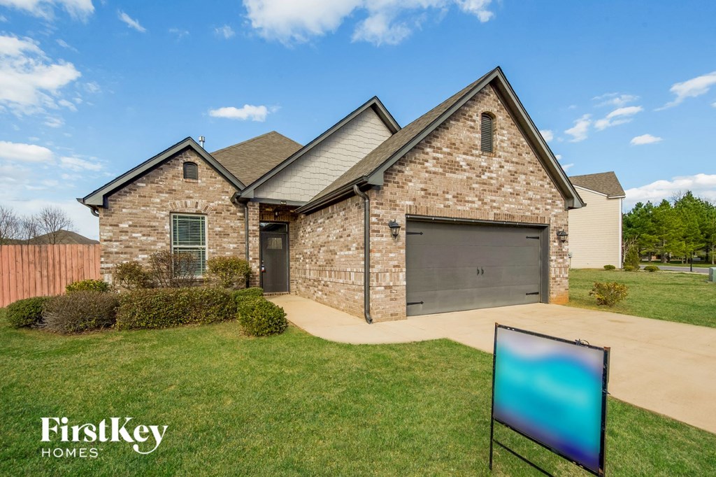 A house with a sign that says "FirstKey Homes" in front of it.