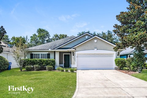 a home with a driveway and a garage door