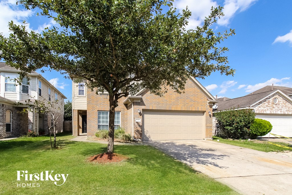 a house with a tree in the front of it