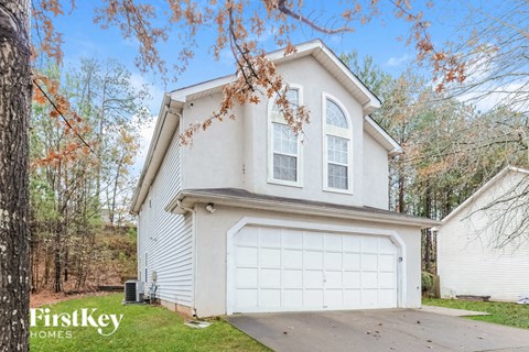 A house with a garage is for sale by FirstKey Homes.