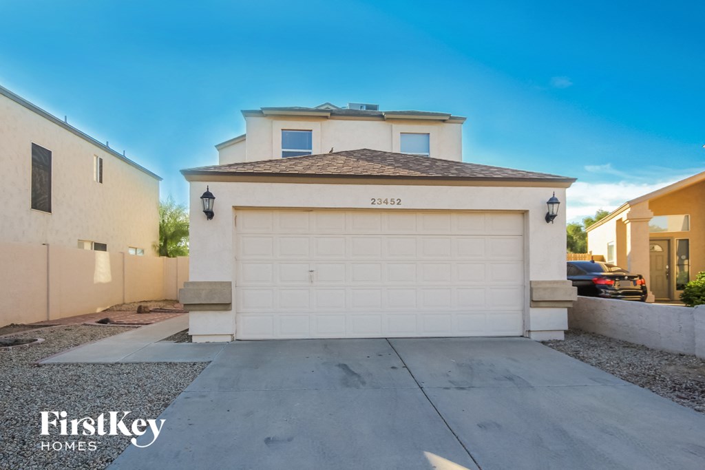 a white garage door in front of a house