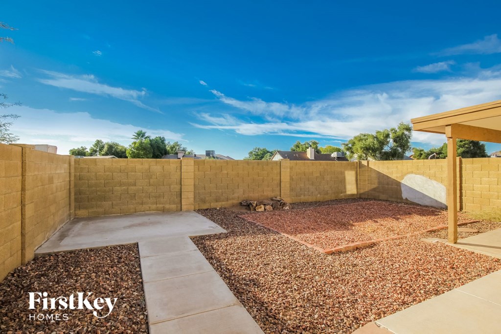 a fisheye view of a backyard with a fence and a patio