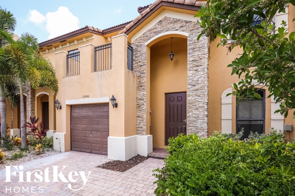 a house with a driveway and a garage door