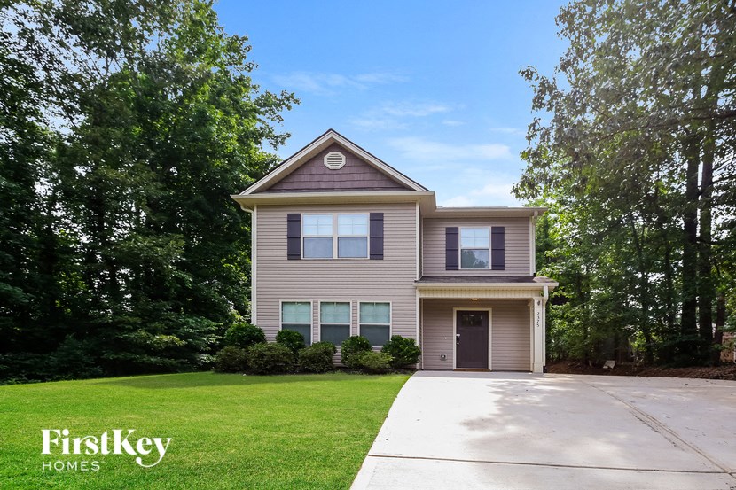 A house with a driveway in front of it.