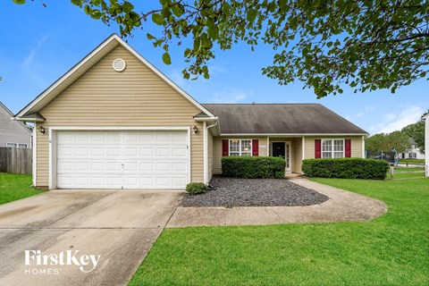 a home with a white garage door and a driveway