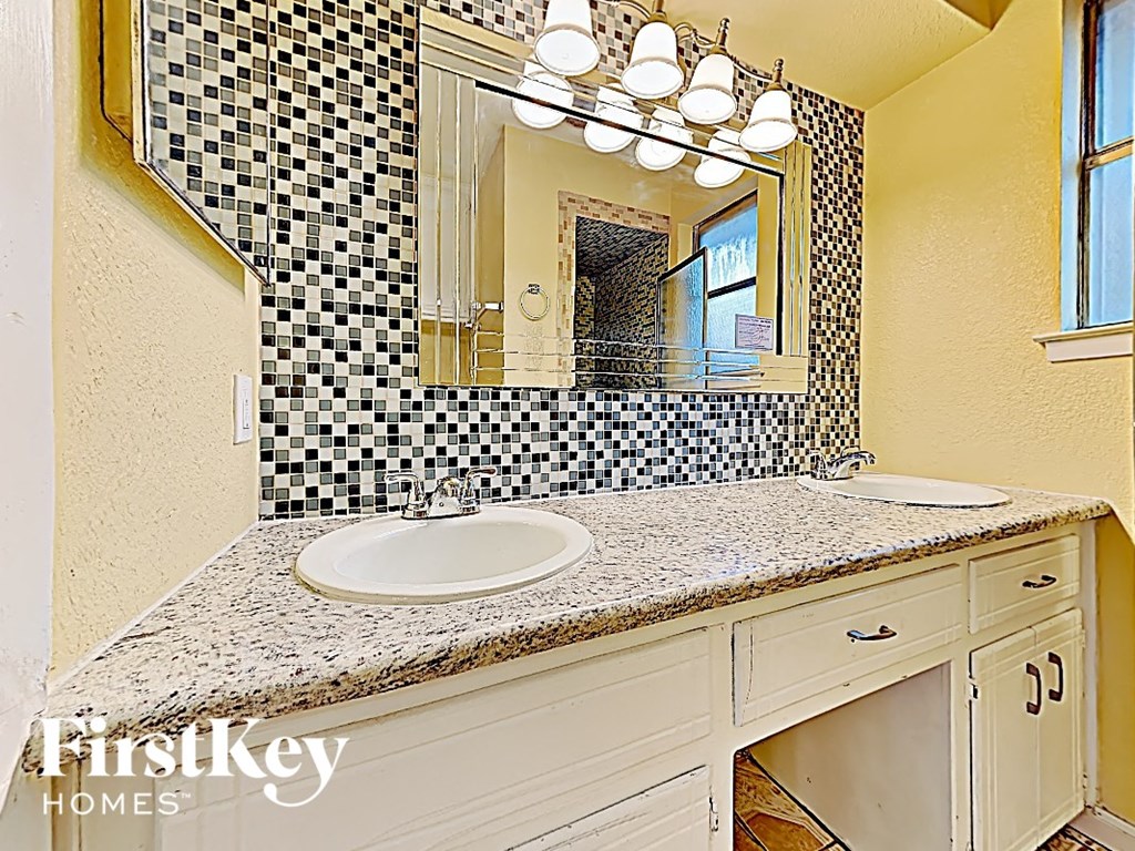 a bathroom with a sink and a mirror