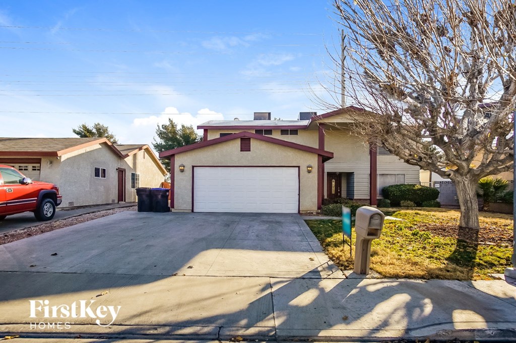 a house with a driveway and a parking meter