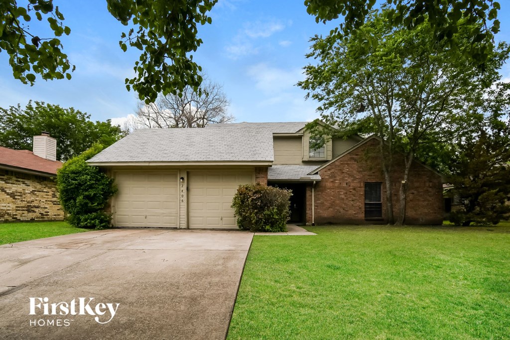 a house with a driveway and a garage door