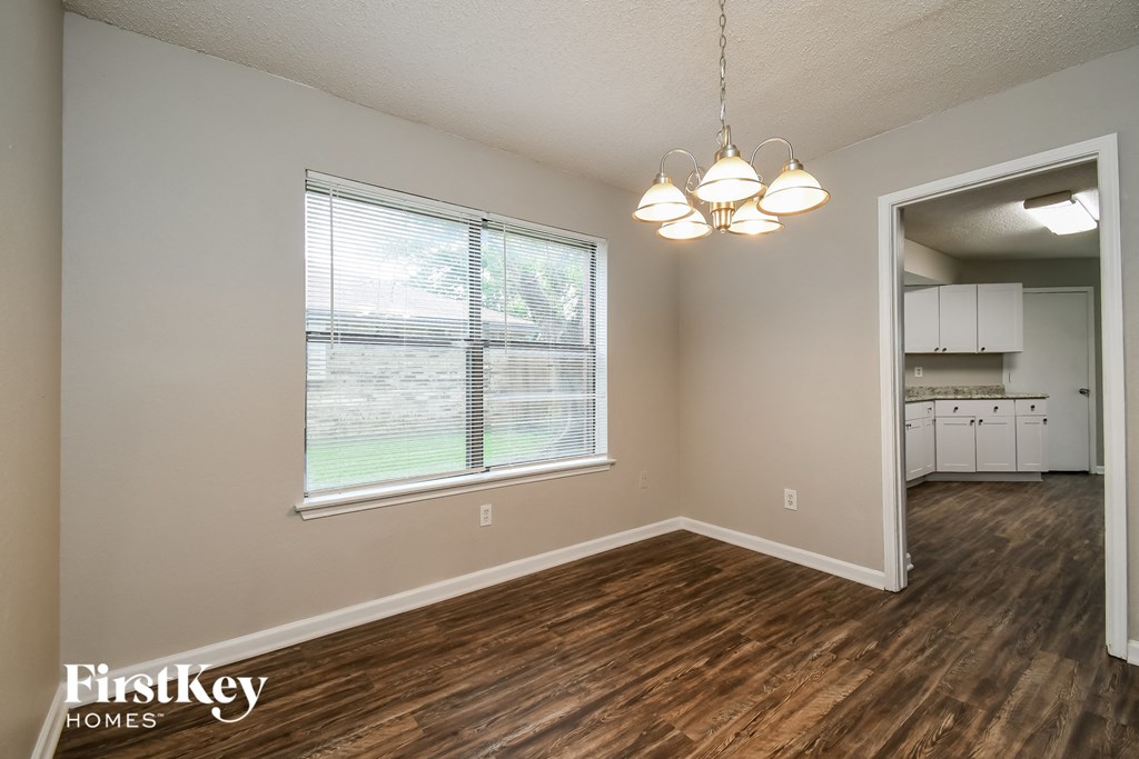the living room and dining room of an open floor plan