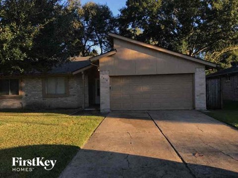 a house with a driveway and a garage door