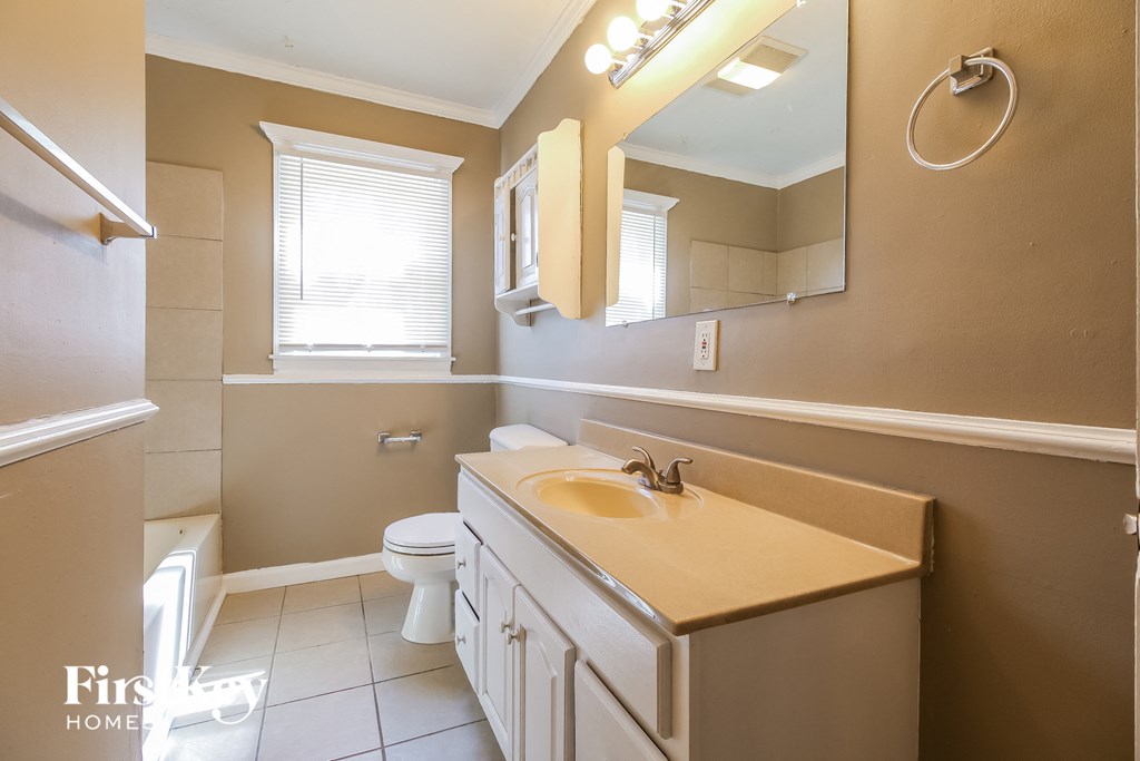 a bathroom with a sink and a toilet