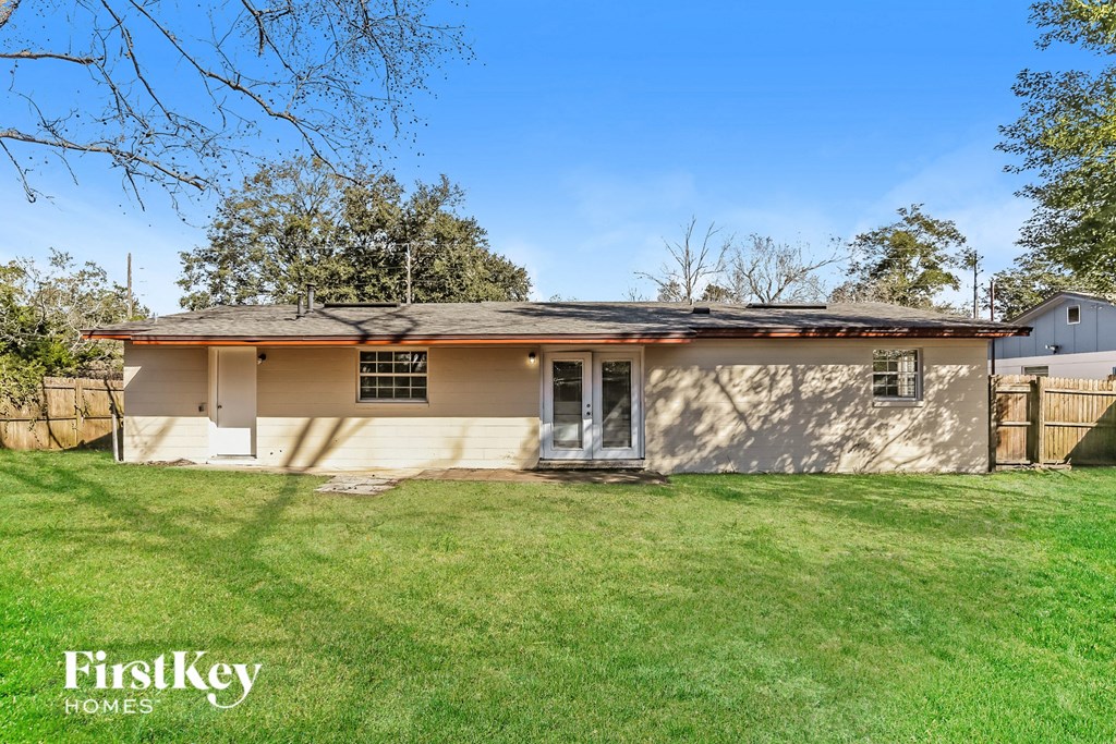 A house with a lawn in front of it.