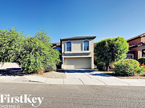 a house with a garage door on a street