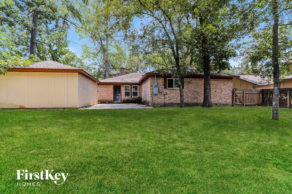 A house with a lawn in front of it.