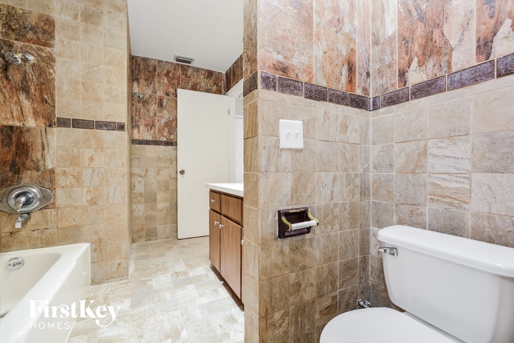 a bathroom with a toilet and a sink