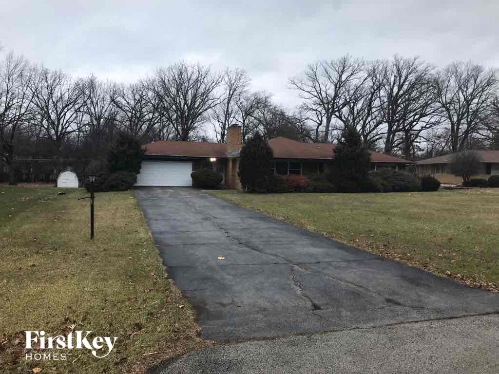 a house with a driveway and a white garage door