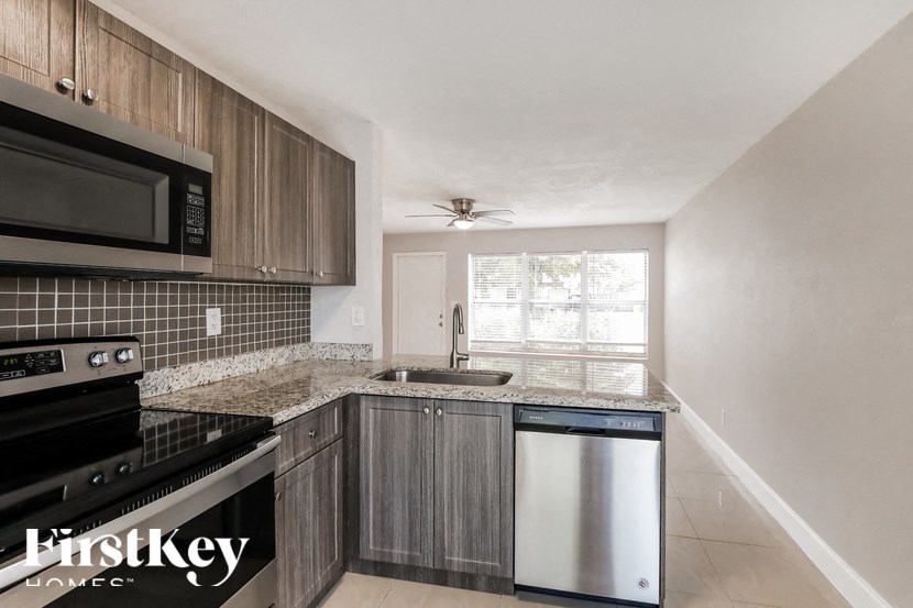 a kitchen with stainless steel appliances and a counter top