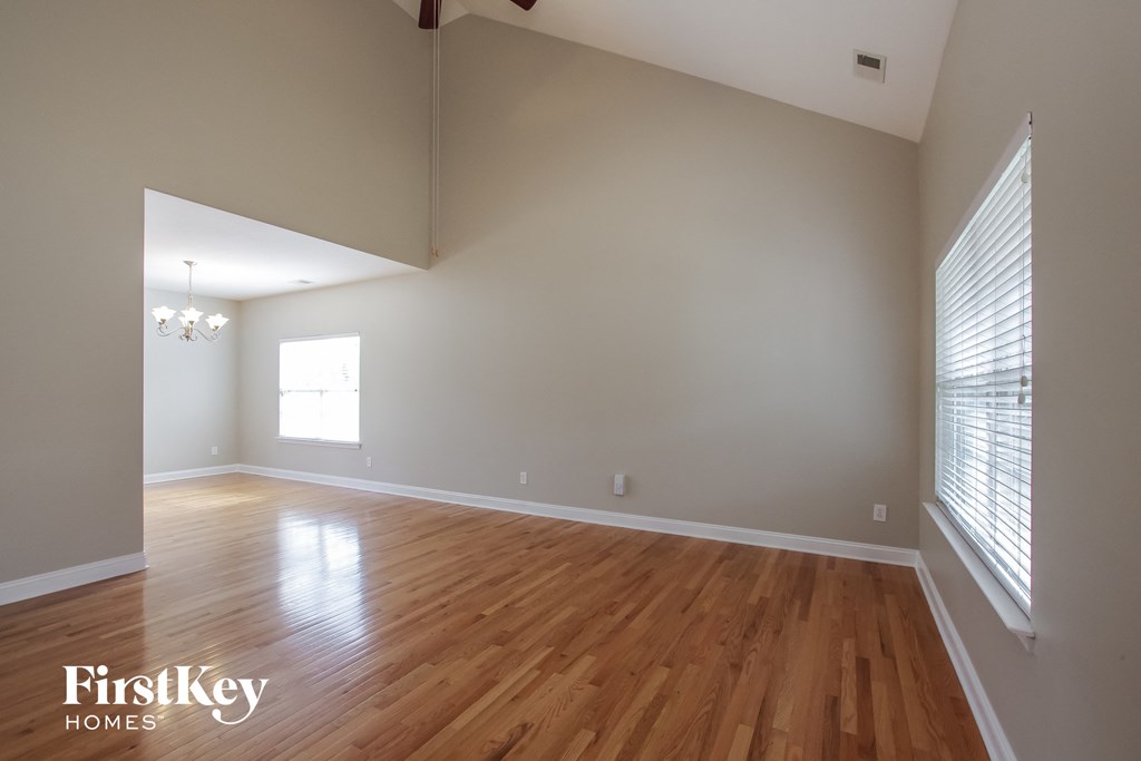 the living room and dining room with wood floors