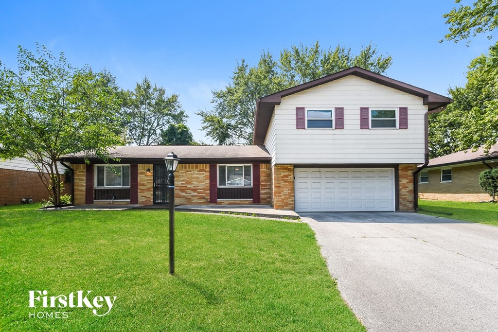 A house with a garage is for sale by FirstKey Homes.