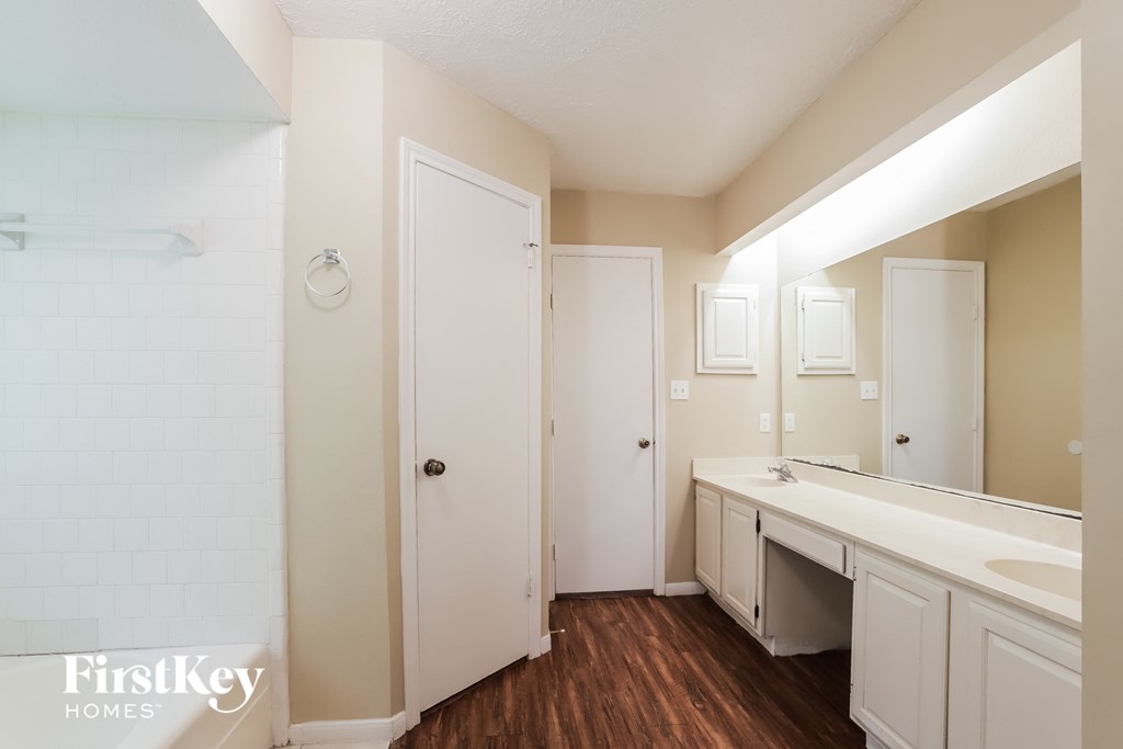 the preserve at ballantyne commons apartment bathroom with sink and mirror