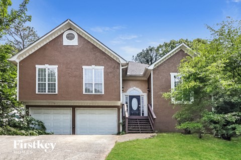 a brick house with a white garage door