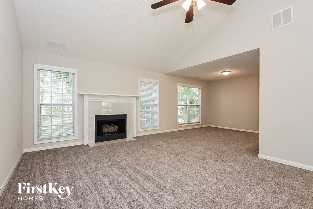 the living room of a house with a fireplace