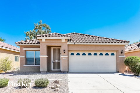 a house with a garage and a white door