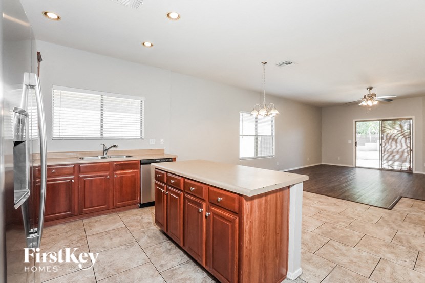 a kitchen with wooden cabinets and a white counter top
